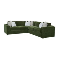 a green sectional couch with pillows on it's back and side facing each other