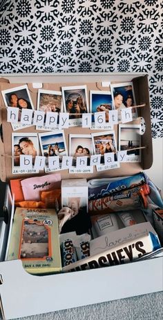 an open suitcase filled with photos and pictures