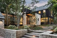 a modern house with stone steps leading up to it