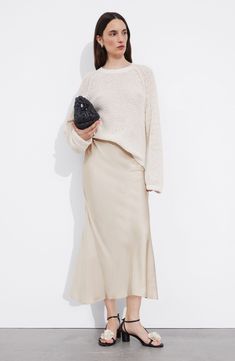 A staple skirt features curvy seaming for timeless, easygoing drape. Hidden side-zip closure 100% viscose Dry clean or machine wash, line dry Imported White Blouse Top, Jumpsuit And Blazer, Knit Outerwear, Linen Sweater, Satin Midi Skirt, Slip Skirt, Clothing Essentials, Fashion Story, Wide Leg Denim