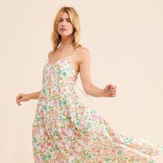 Feminine A-line Maxi Dress For Day Out, Breezy A-line Spring Dress, Feminine Midi Sundress For Day Out, Feminine Midi Length Sundress For Day Out, Feminine Midi Length Sundress For Brunch, Floral Midi Sundress For Daywear, Floral Print Long Midi Dress For Daywear, Feminine Flowy Midi Sundress, Spring Midi Sundress For Brunch