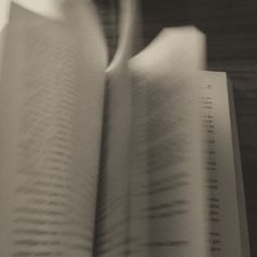 an open book sitting on top of a table