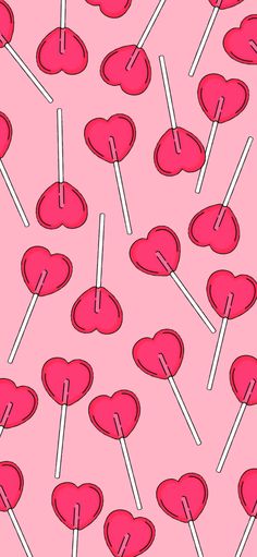 pink lollipops with hearts on them