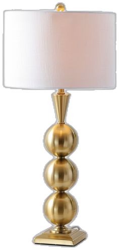 a gold lamp with a white shade on it