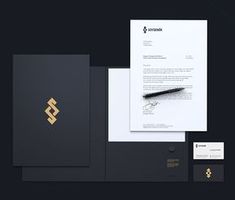 the stationery is designed to look like it has been made with black paper and gold foil