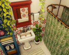 a bathroom with green and red decor on the walls