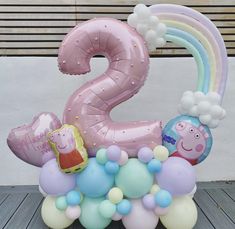 a number two balloon with balloons on the bottom and peppa pig in the middle