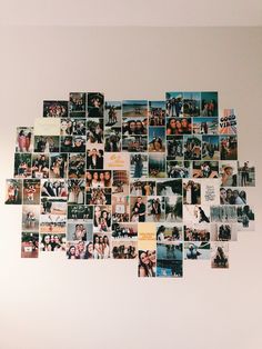 a bunch of pictures are hanging on the wall