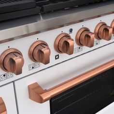 an oven with many knobs and controls on it