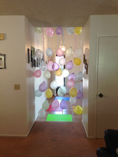 the hallway is decorated with balloons and streamers