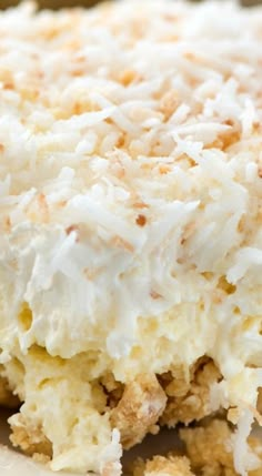 a close up of a cake with coconut topping