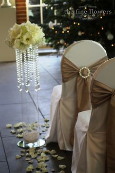 the chairs are set up for a wedding ceremony with flowers and petals on the floor