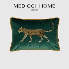 a green pillow with a leopard on it and the words medicoi home outlet