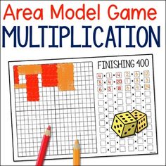 an area model game with two dices and pencils next to it on top of a