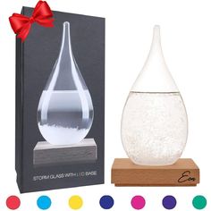 PRICES MAY VARY. ✔LIVE WEATHER FORECAST AT HOME: Check out the weather any time you want with a little help from our glass storm weather forecast predictors. This colored storm glass ornament is filled with highly concentrated liquid and uniquely shaped crystals that change consistency as the weather and temperatures change! Awesome, right? ✔COMPLEMENT ANY AREA AROUND: Skyrocket your home décor without having to spend a small fortune on pricey decorators. Add an Eon Concepts storm glass weather Office Birthday, Beautiful Bars, Barometer, Easter Fun, Easter Gifts, Wood Glass, Perfect Birthday, Elegant Gift, Glass Ornaments