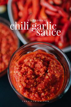 chili garlic sauce in a glass bowl with red peppers behind it and the title overlay reads vietnamese chilli garlic