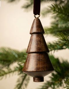 a wooden ornament hanging from a christmas tree