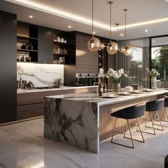 a modern kitchen with marble counter tops and black chairs in front of an open window