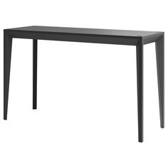 a black table sitting on top of a white floor