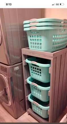 a washer and dryer sitting next to each other in front of a washing machine