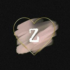 a heart with the letter m painted on it's side in pink and gold