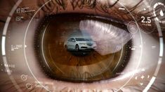 an eye looking at a car through it's iris, with the image of a car in the center