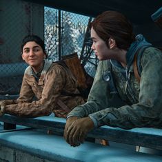 two people sitting on the bleachers looking at each other in uncharted video game