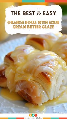 the best and easy orange rolls with sour cream butter glaze on a white plate