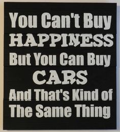 a sign that says you can't buy happiness but you can buy cars and that's kind of the same thing