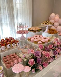 a table filled with lots of desserts and cupcakes