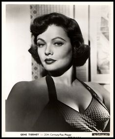 a black and white photo of a woman wearing a bra