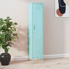 a tall blue locker next to a potted plant in a room with a painting on the wall