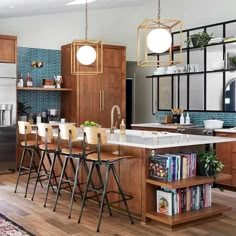 a kitchen with wooden cabinets and white counter tops next to an island in the middle