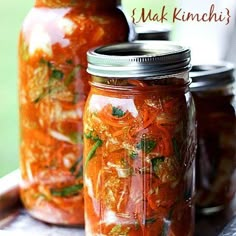 three jars filled with food sitting on top of a metal tray