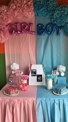 a table with pink and blue decorations on it