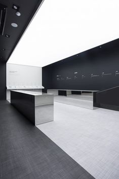 an empty room with black and white walls