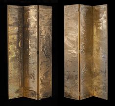 four panel gold leafed screen on black back ground, with two panels facing each other