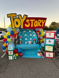 an inflatable toy story booth with balloons and toys