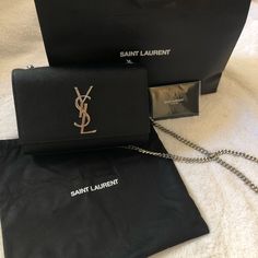 Saint Laurent's Crossbody Bag Made From Black Textured-Leather Topped With A Polished Silver-Tone Monogram. Can Be Worn Over One Shoulder Or Tuck The Chain Shoulder Strap Inside. Featuring A Silver-Tone Chain Shoulder Strap And Logo Plaque. Made In Italy. Bought In Usa In 2019 And Worn Many Times But Still In Great Condition. There Are Some Light Stains Inside The Bag. Does Not Come With Box And Dust Bag. Bags Ysl, Yves Saint Laurent Bags, Black Textures, Black Crossbody, Light Stain, Leather Top, Bag Making, Yves Saint Laurent, Black Silver