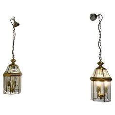 two hanging lights with one light on each side and the other off to the side