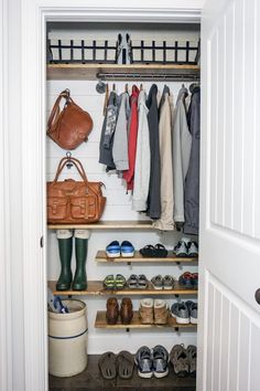 an open closet with shoes, bags and handbags