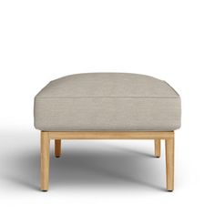 a small footstool sitting on top of a white floor