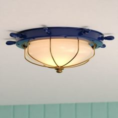 a blue ceiling light hanging from the ceiling