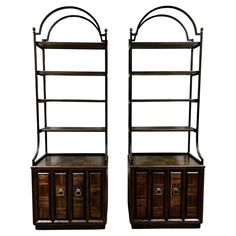 a pair of bookcases with drawers on each side