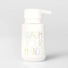 a white bottle with the words wash your hands on it