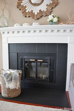 a living room with a fire place and mirror on the wall above it's mantle