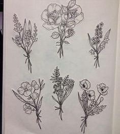 a bunch of flowers are drawn on a piece of paper