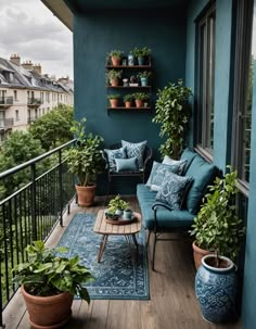 a balcony with potted plants and blue walls