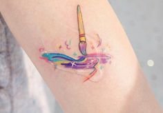 a person with a colorful tattoo on their arm