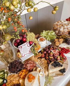 a table topped with lots of different types of food